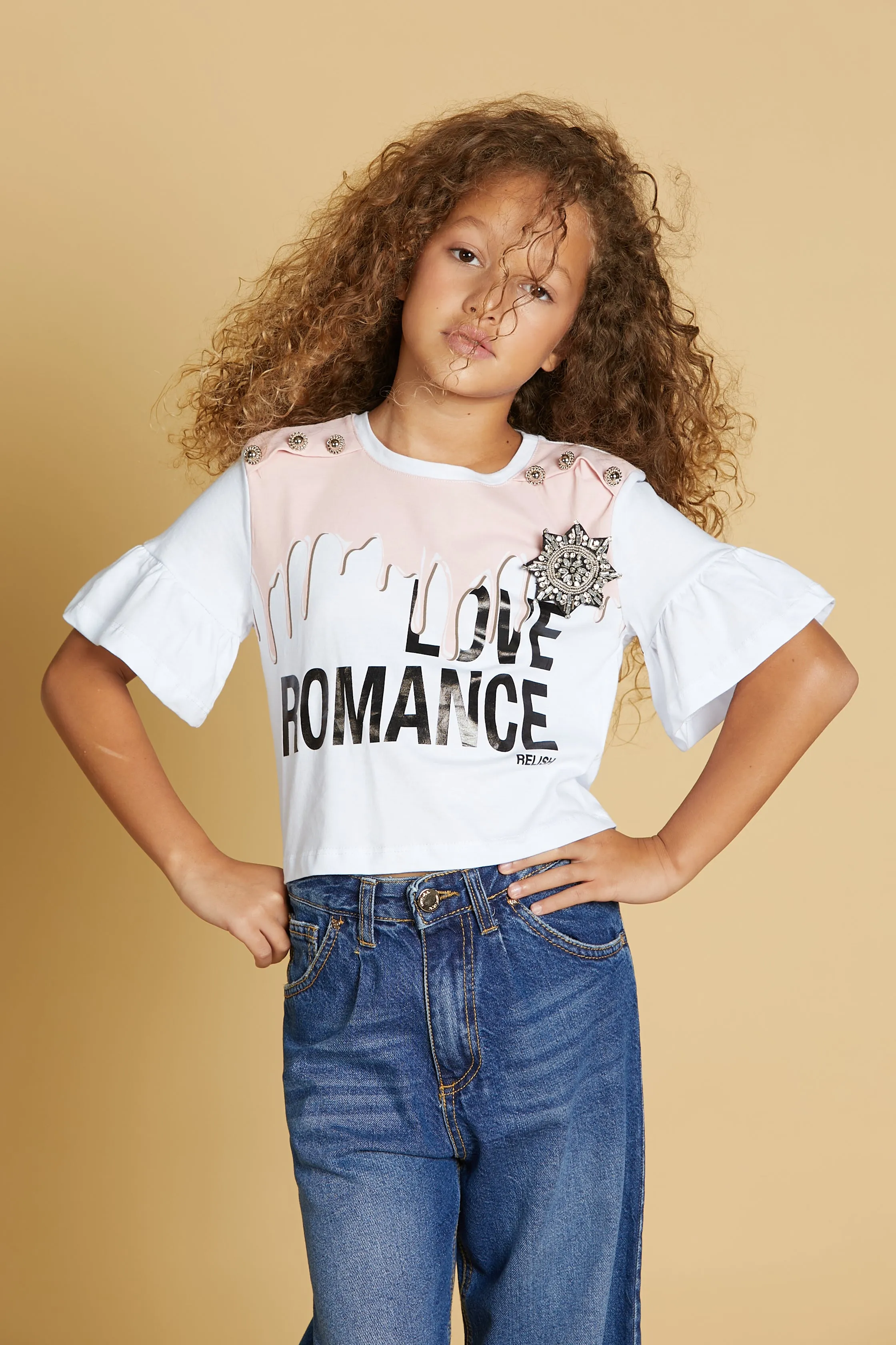 T-shirt APUS corta m/m volant con stampa più bottoni spalla più  spilla strass