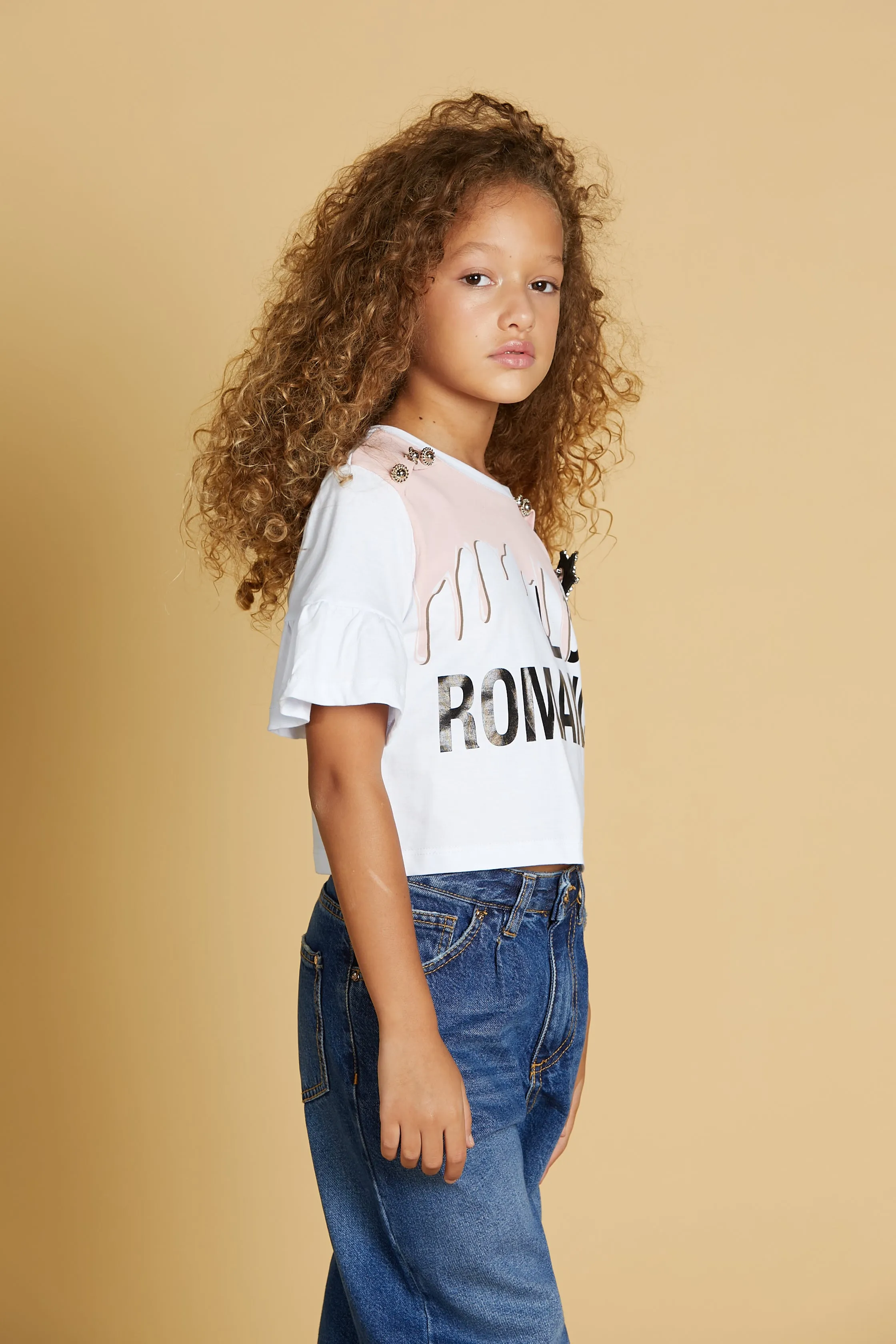 T-shirt APUS corta m/m volant con stampa più bottoni spalla più  spilla strass